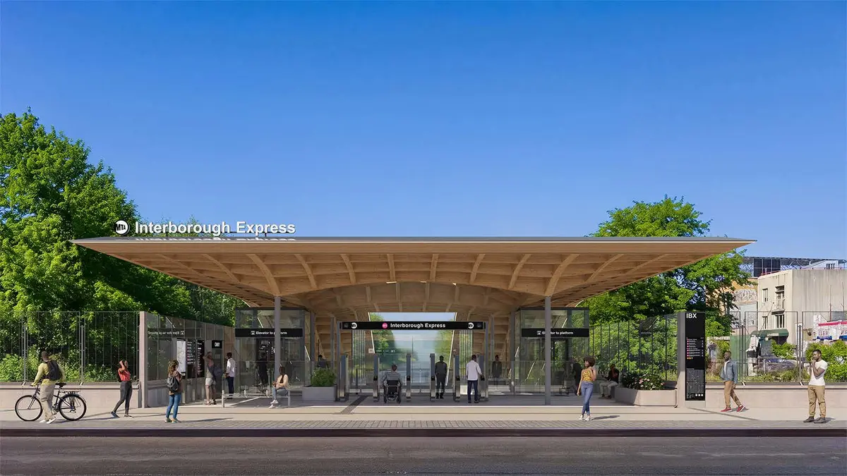Interborough Express station entrance with elevators, a broad canopy and street-level access
