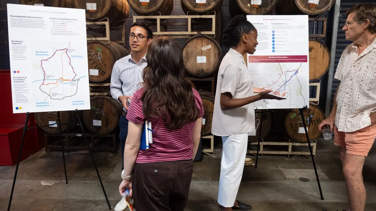 Attendees discuss Beltline Transit Study maps at the September 2026 Citywide Conversation