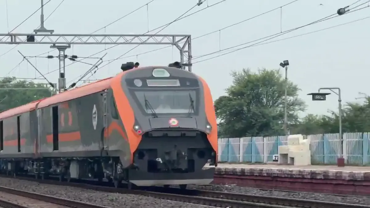 Vande Bharat Freight EMU passes an electrified station during trials in Kota Division
