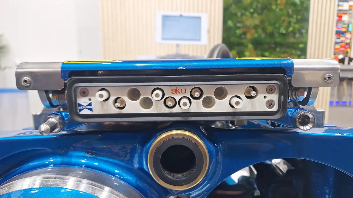 Electrical contact unit on a blue Voith CargoFlex Hybrid digital automatic coupler