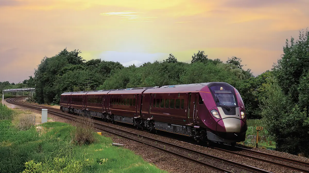 East Midlands Railway Class 810 Aurora train travelling through a green cutting