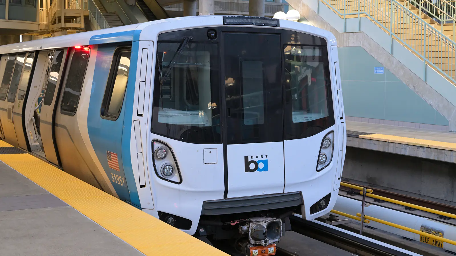 BART Red Line train at the platform at Millbrae Station