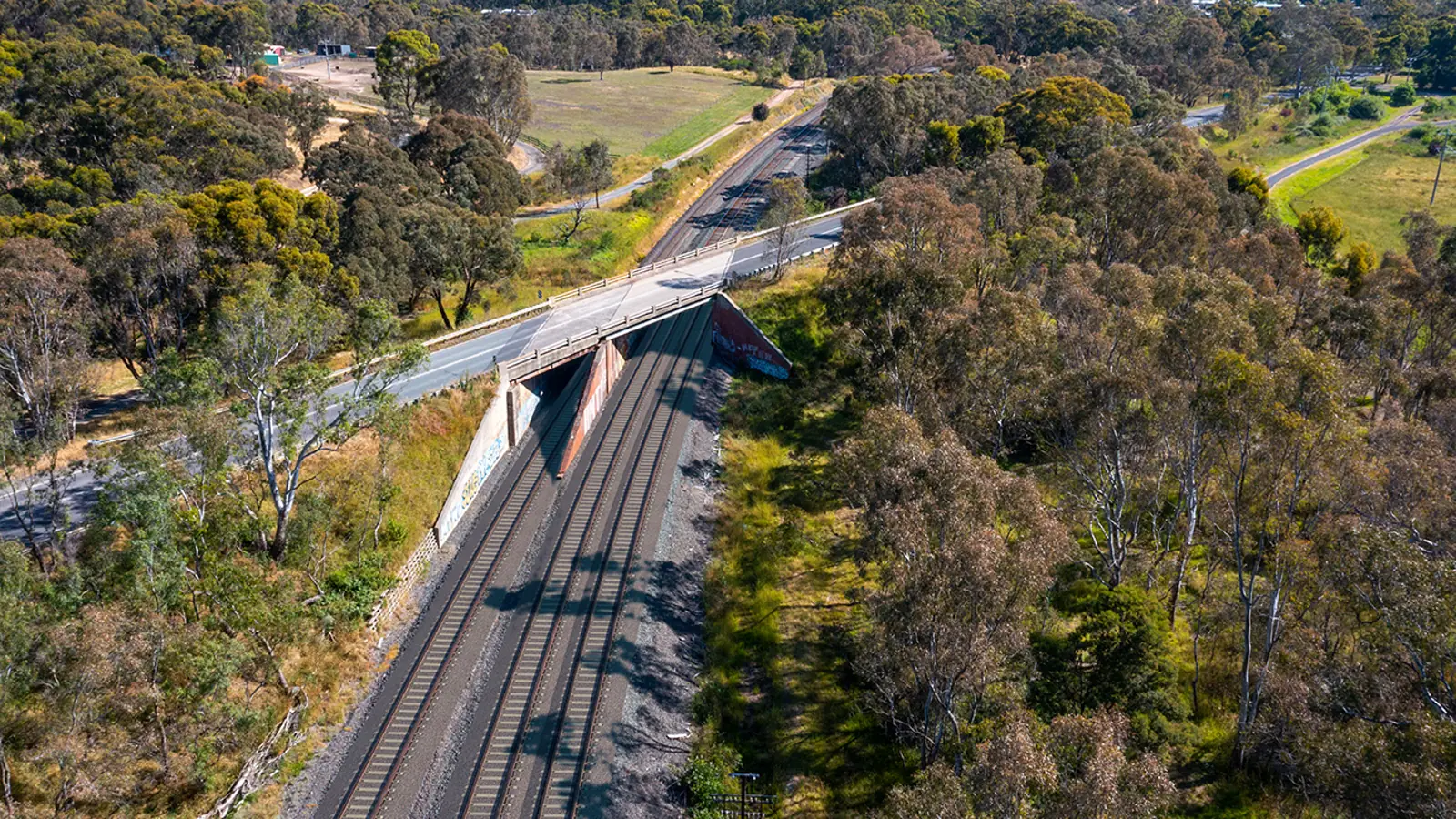 Aerial view of the former Marchbanks Road bridge crossing railway tracks in Broadford