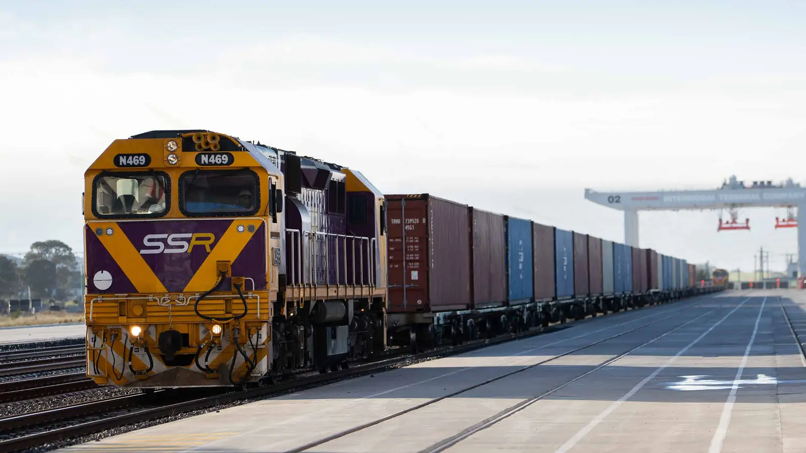 Southern Shorthaul Railroad locomotive N469 hauling containers through an intermodal terminal in Victoria