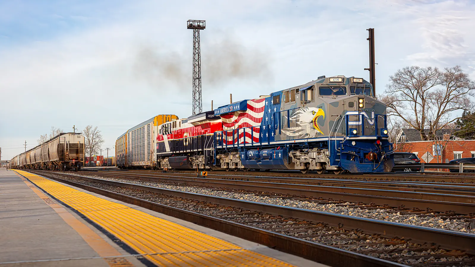 CN locomotives 1776 and 2026 leading a freight train through Homewood, Illinois