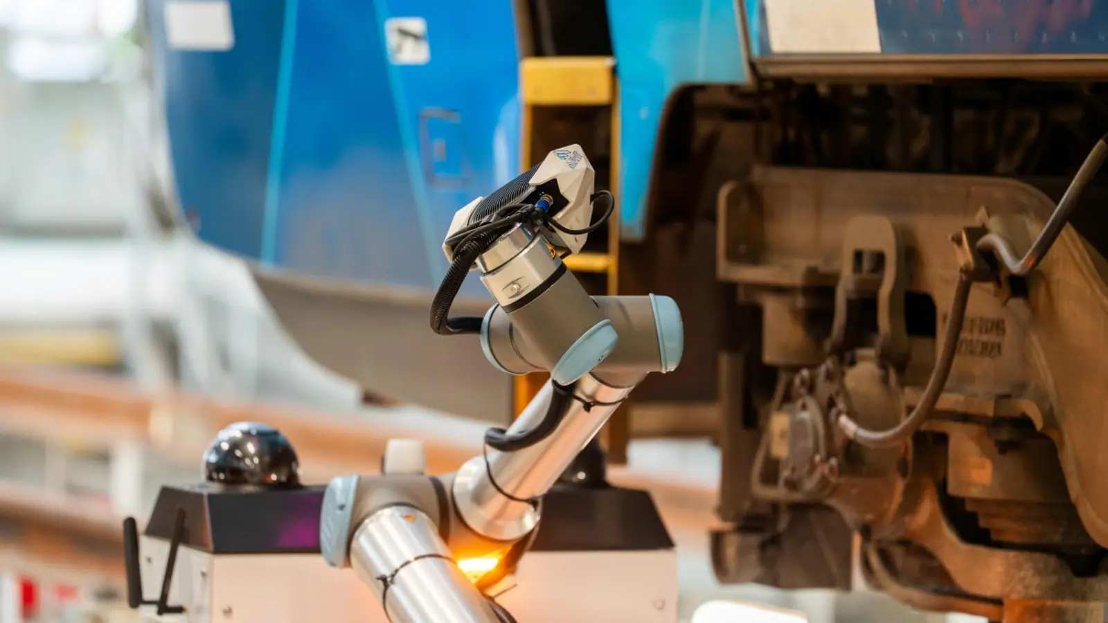 Downer robotic inspection arm beside rail equipment for the InnoTrans 2026 innovation showcase