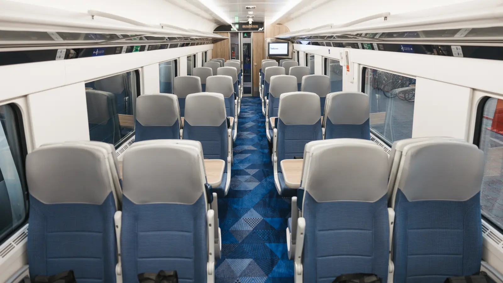 Chiltern Explorer passenger carriage with grey seats and blue carpet