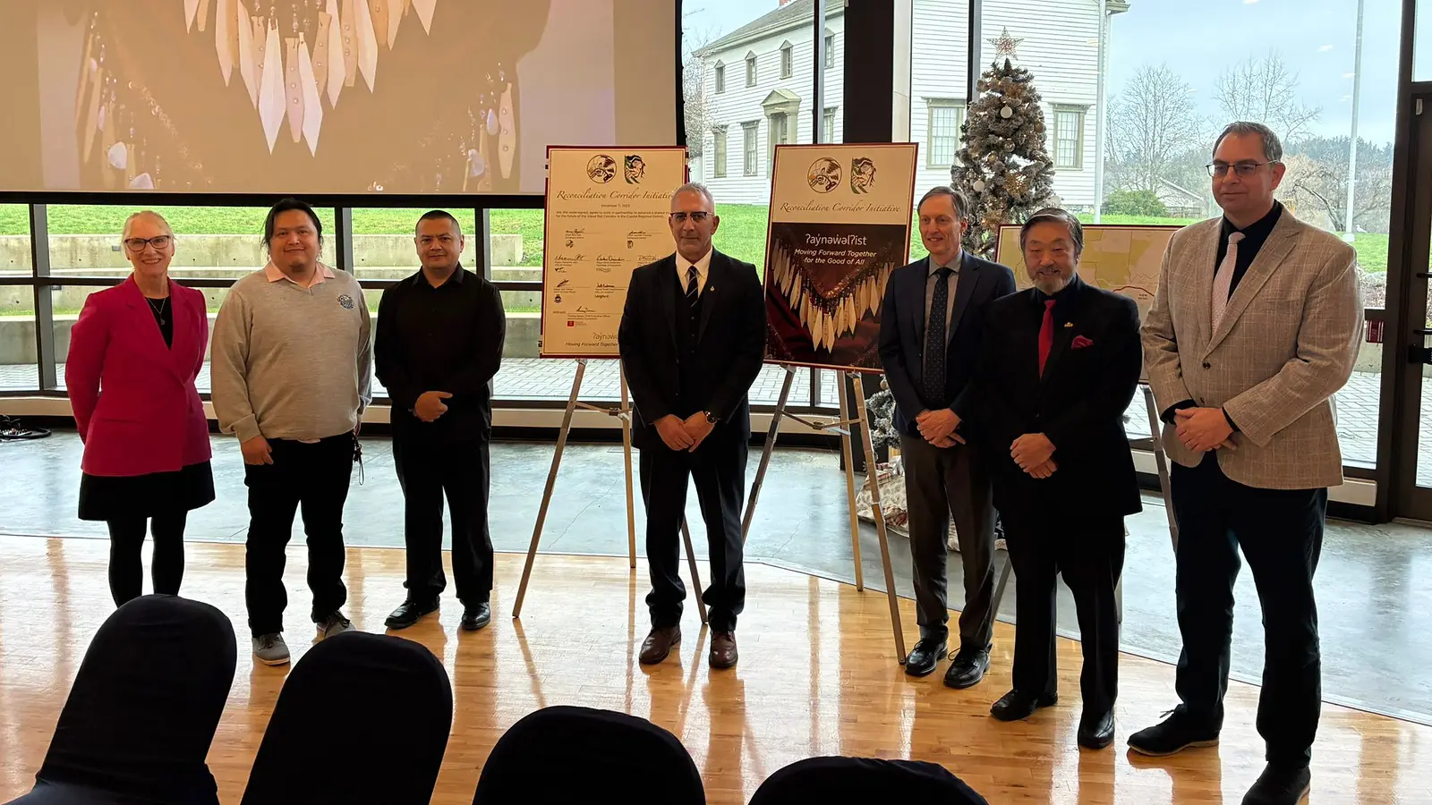 Reconciliation Corridor Initiative partners standing beside signed agreement boards