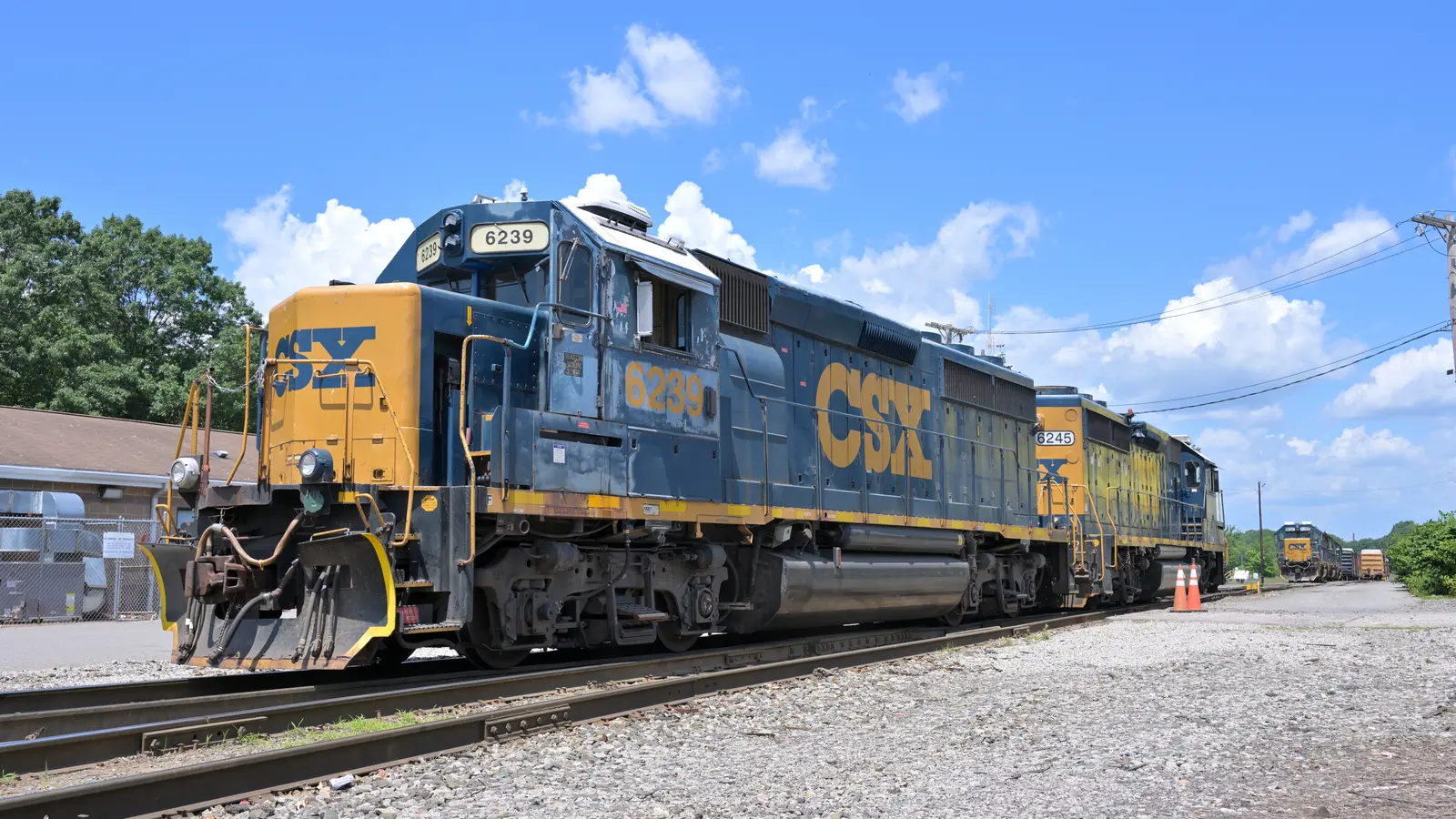 Two CSX GP40-2 locomotives standing beside multiple tracks at Framingham North Yard