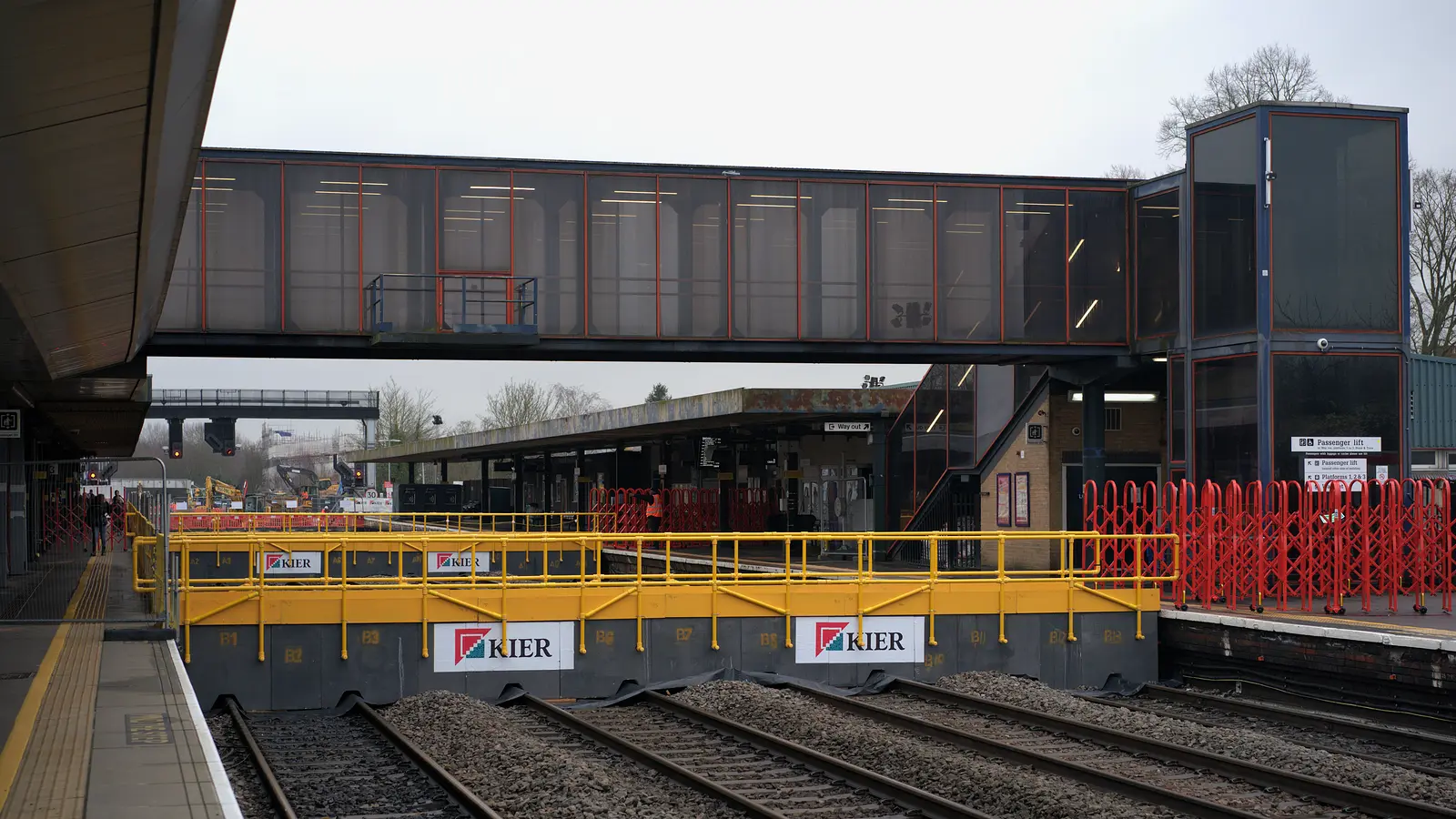 Oxford station footbridge and platforms behind construction barriers