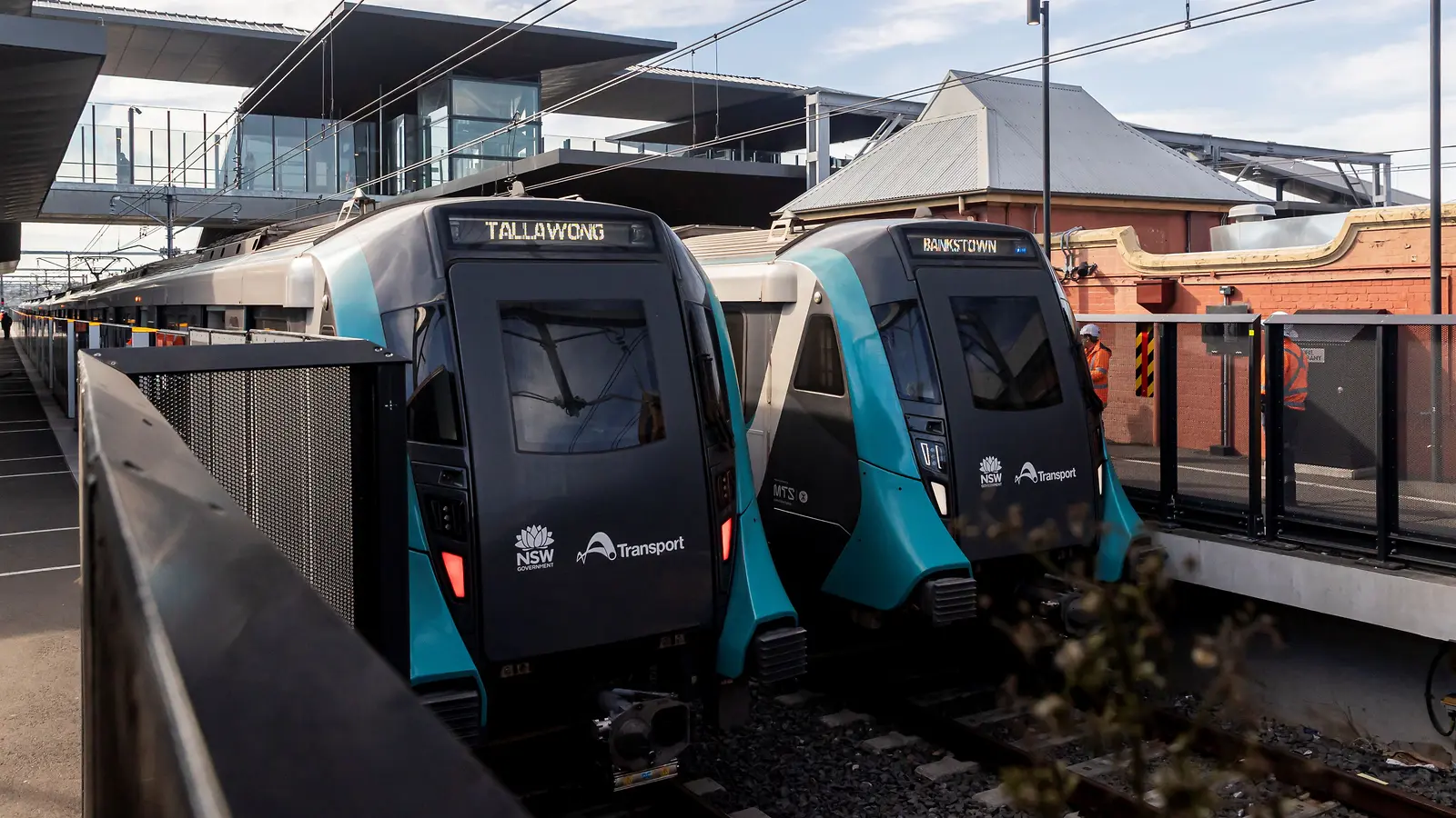 Two Sydney Metro trains display Tallawong and Bankstown destinations at Sydenham Station