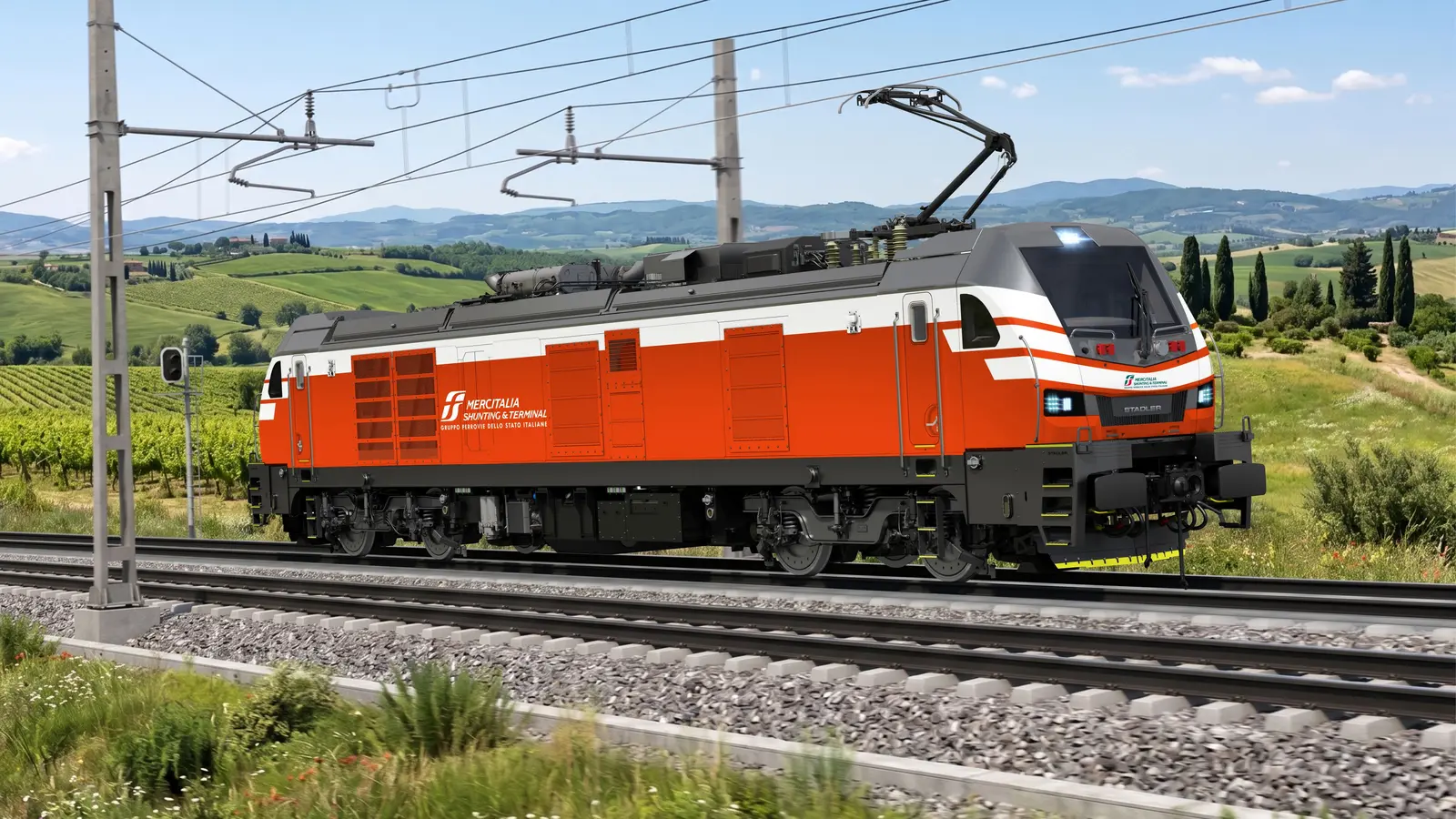 Stadler bi-mode locomotive in Mercitalia Shunting & Terminal livery under overhead wires