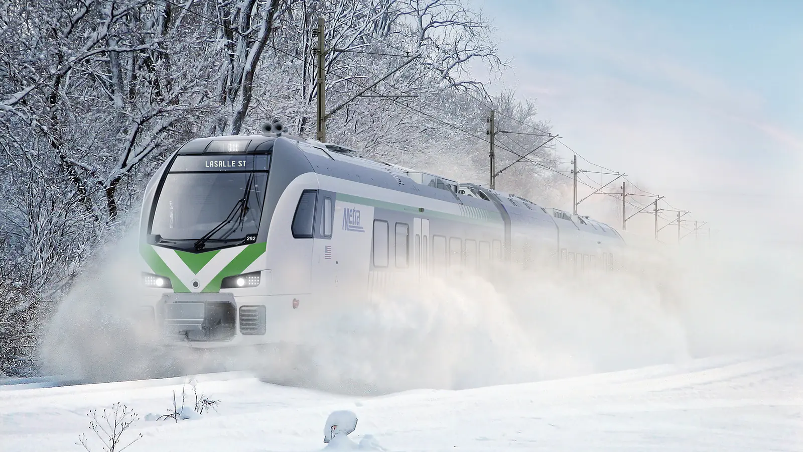 Metra battery-electric FLIRT trainset moving through snow