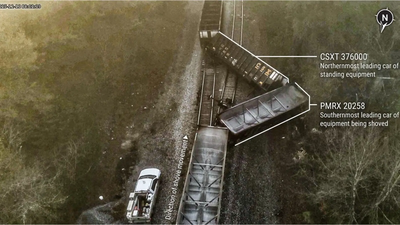 Derailed CSX railcars viewed from above beside tracks in Calera, Alabama