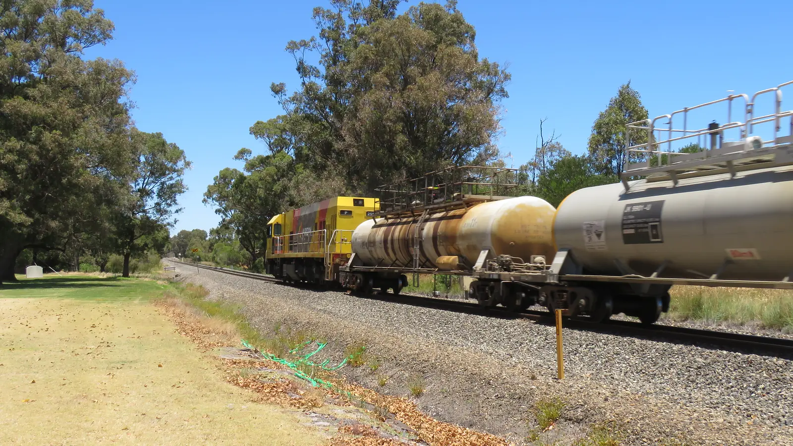 Freight train carrying tank wagons through Yarloop, Western Australia