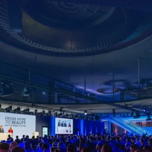 InnoTrans opening session inside palais.Berlin with speakers on stage and a seated audience