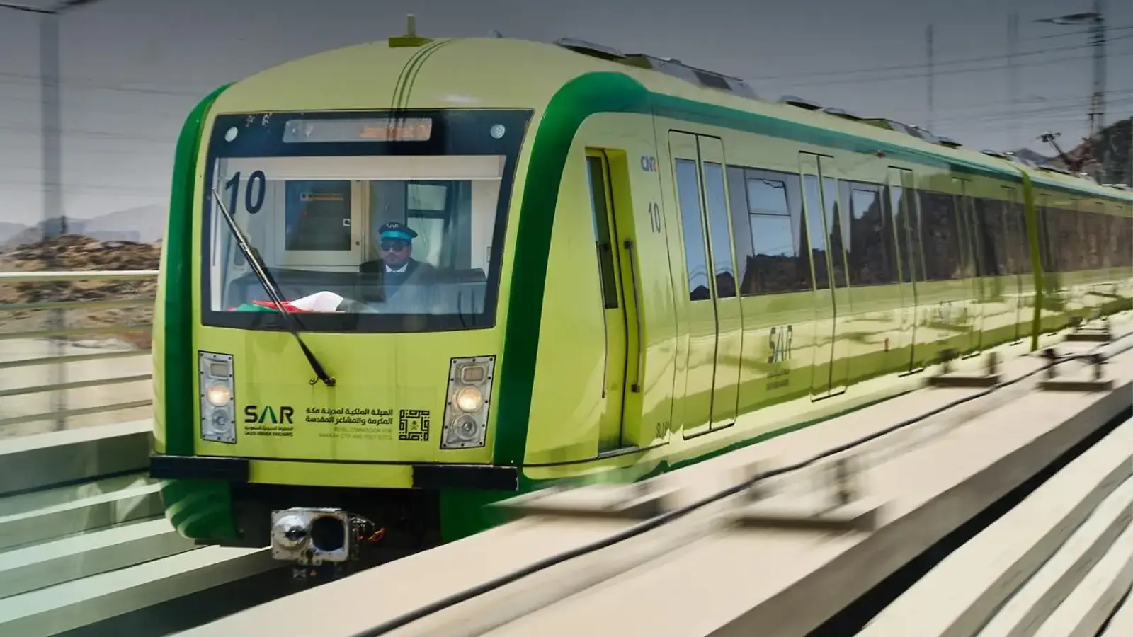 An Al Mashaaer Al Muqaddassah Metro train running on elevated track in Makkah