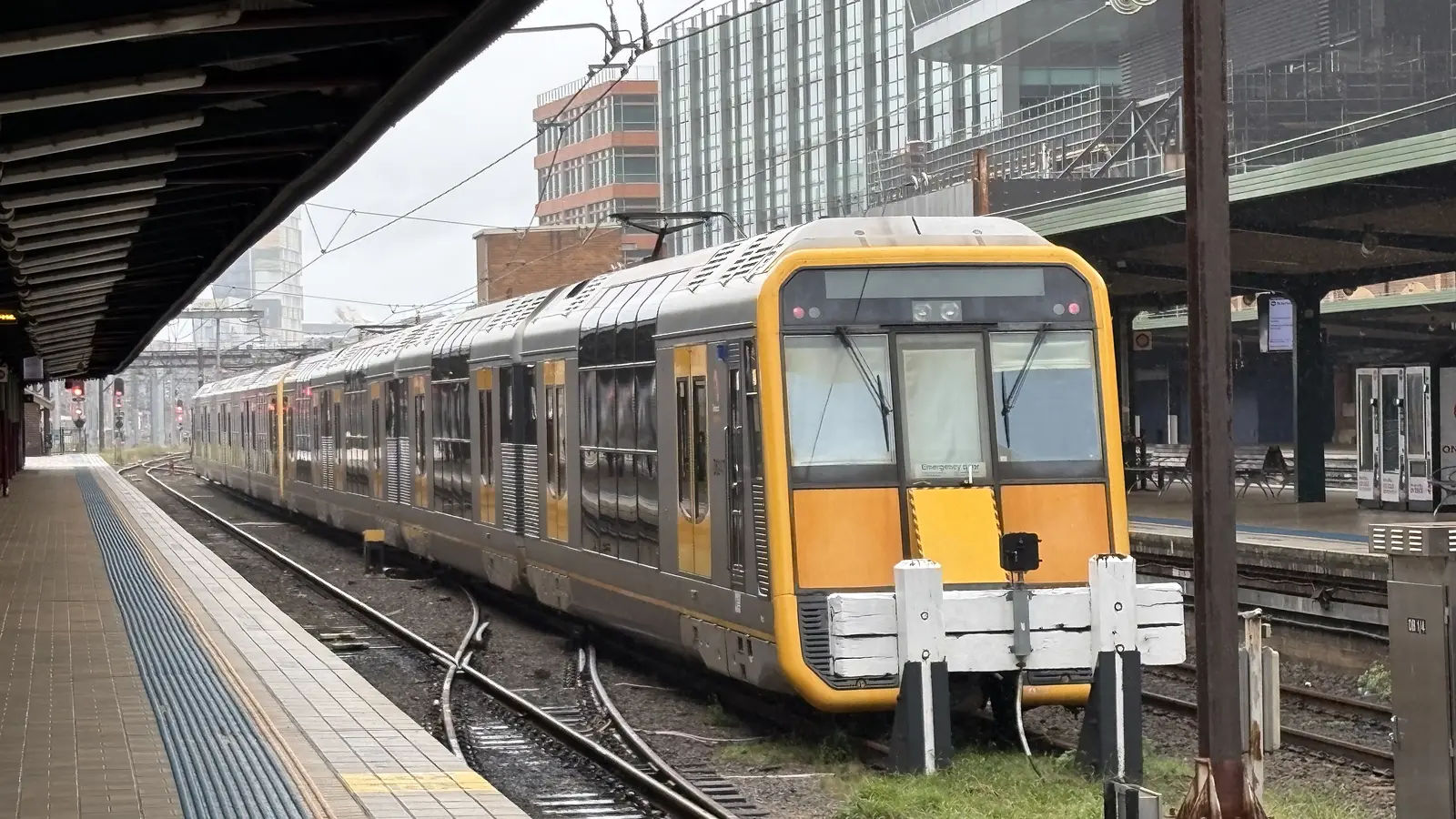 Sydney Trains Tangara set stabled between platforms at Central station