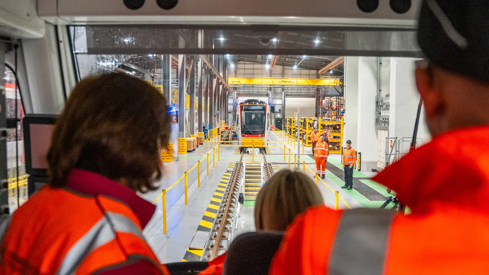 A Class 398 tram-train inside Taff’s Well depot, viewed through a train cab
