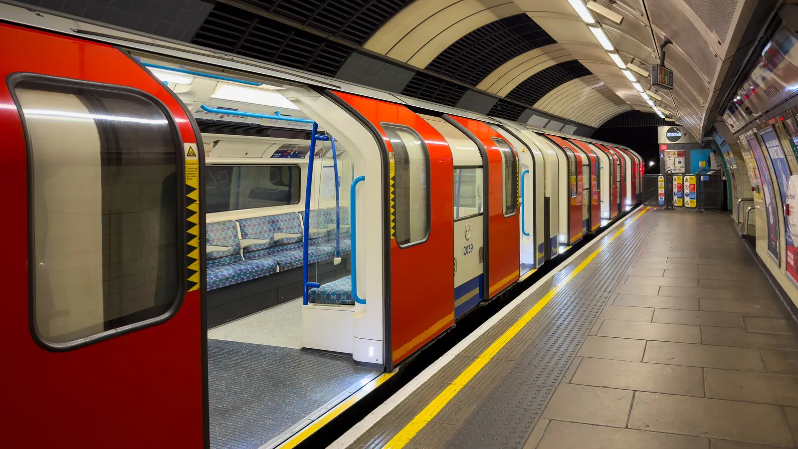Victoria line train with open doors at Brixton Underground station