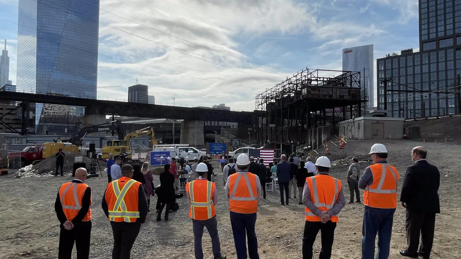 Workers and attendees at the Penn Coach Yard construction site in Philadelphia