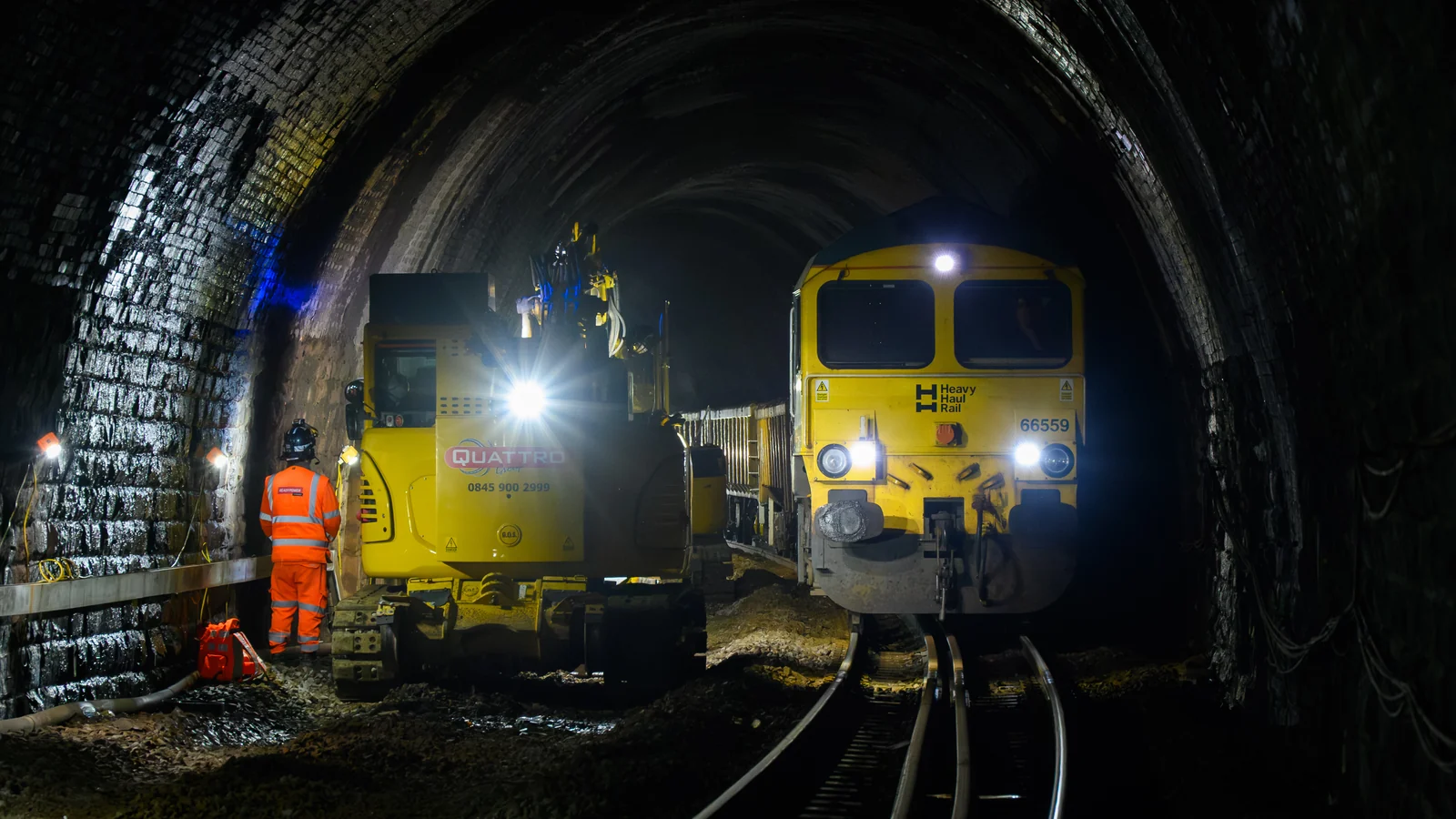 Maintenance plant, a freight maintenance train and a worker inside Eaves Tunnel