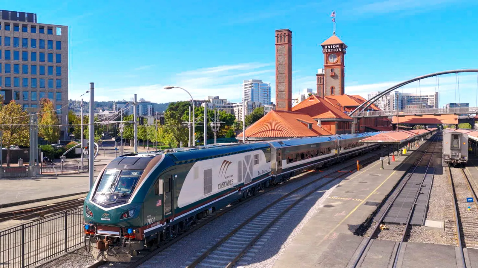 Amtrak Cascades Airo train beside the clock tower at Union Station